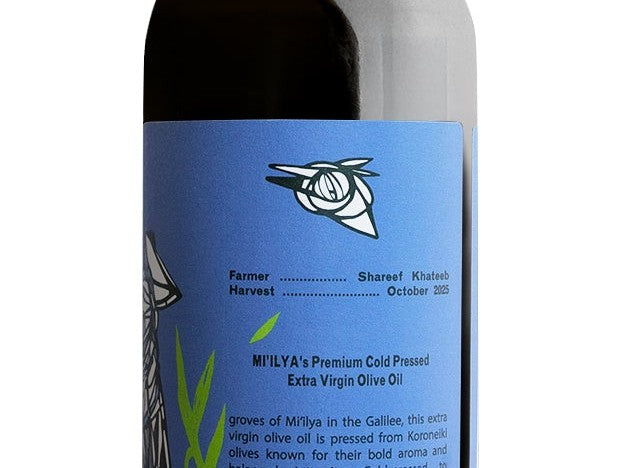 Back label of the Mi'ilya Koroneiki bottle. Printed lines read Farmer Shareef Khateeb and Harvest October 2025.